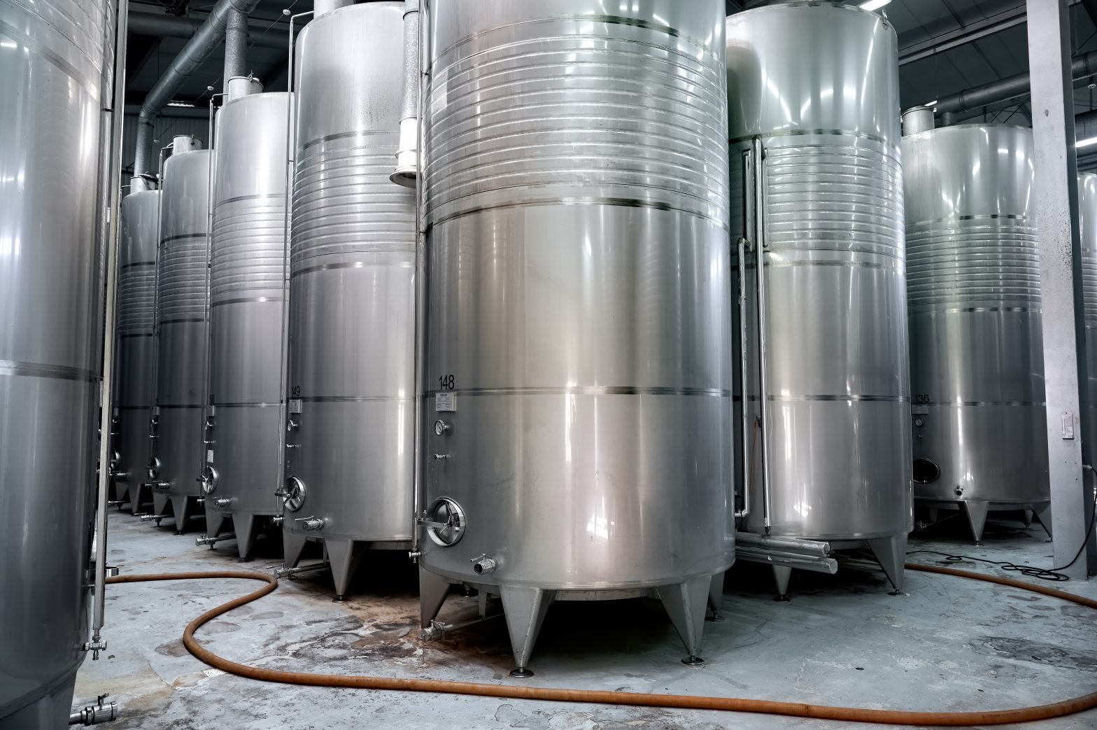 Metallic wine storage tanks at a winery