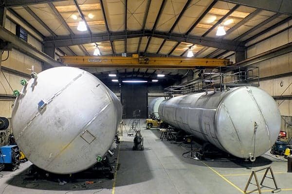 large tanks sitting inside of a building