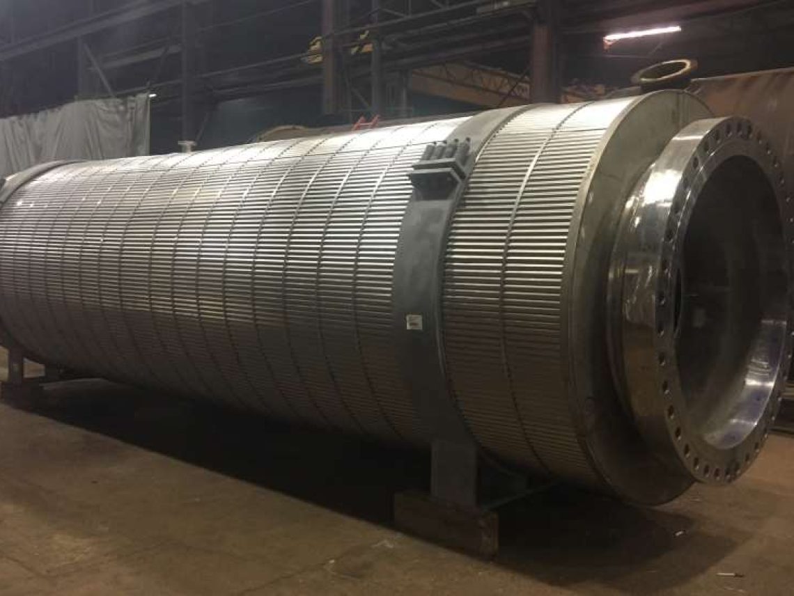 a large metal tube sitting inside of a warehouse