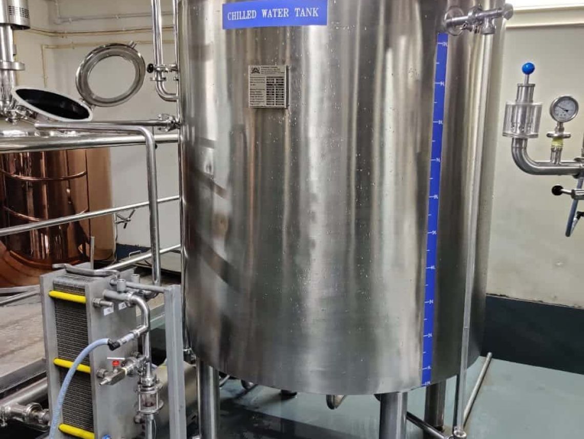 a large stainless steel tank sitting inside of a building