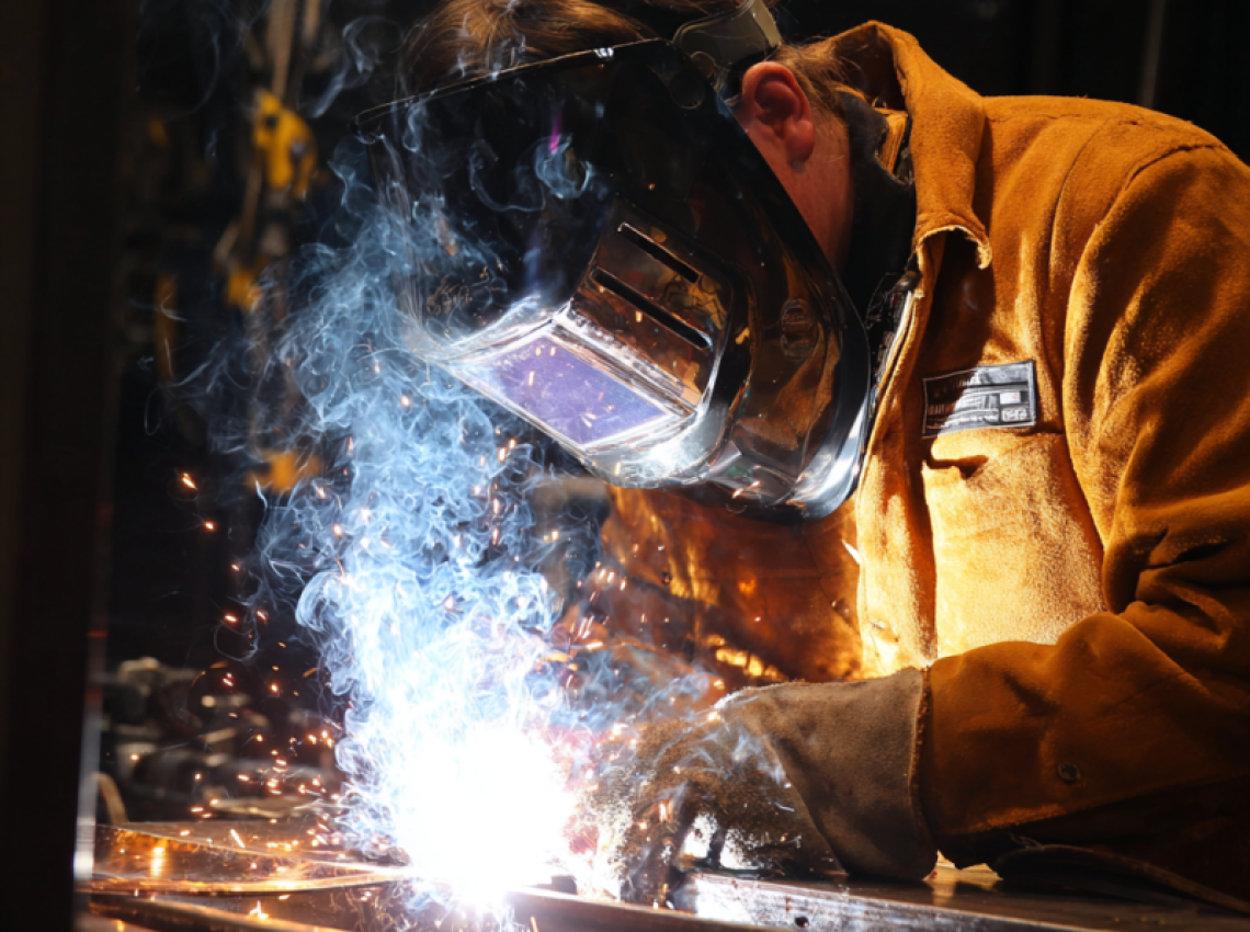 Welder showing how to do 4g welding position overhead technique