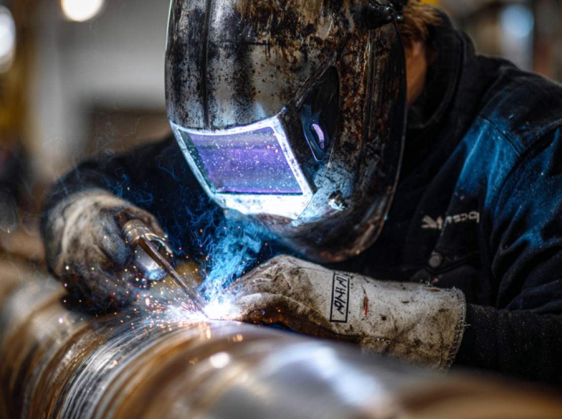 Welder showing how to do 5g welding position on fixed horizontal pipe