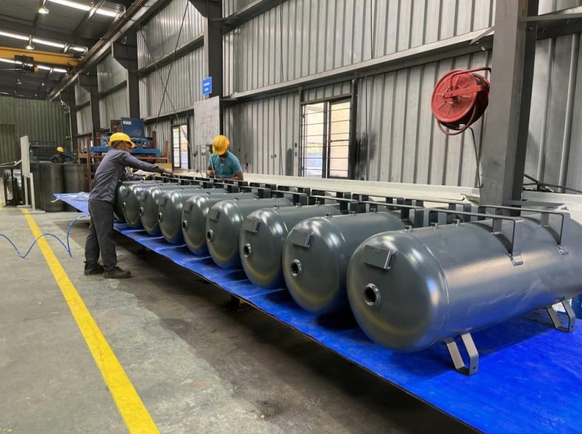 two men working on a machine