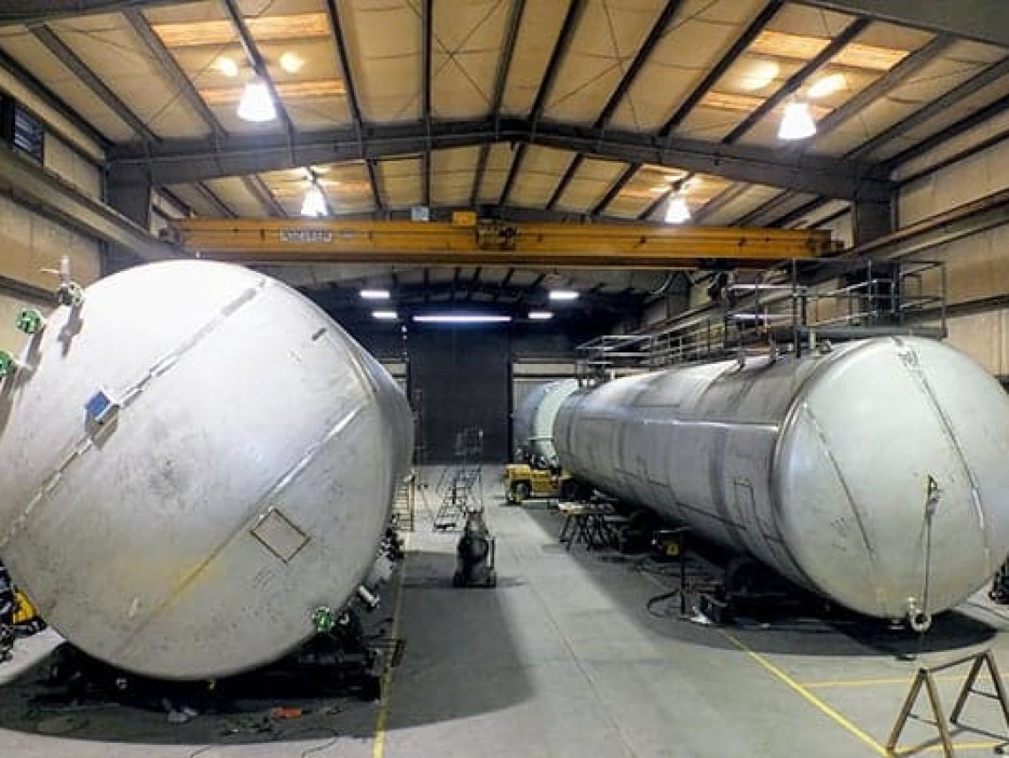 large tanks sitting inside of a building